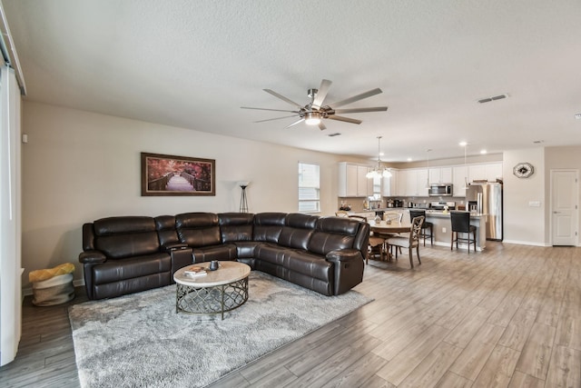 182 Myrtle Oak Ct, Saint Augustine, FL 32092 - living area with ceiling fan, light wood-style flooring, a textured ceiling, recessed lighting, and baseboards