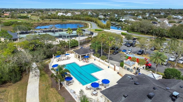 birds eye view of property with a water view