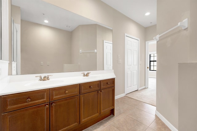 bathroom with tile patterned floors and vanity