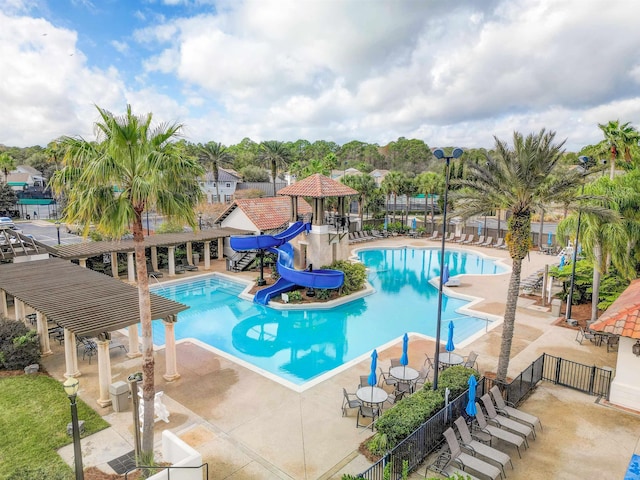 view of pool featuring a patio and a water slide