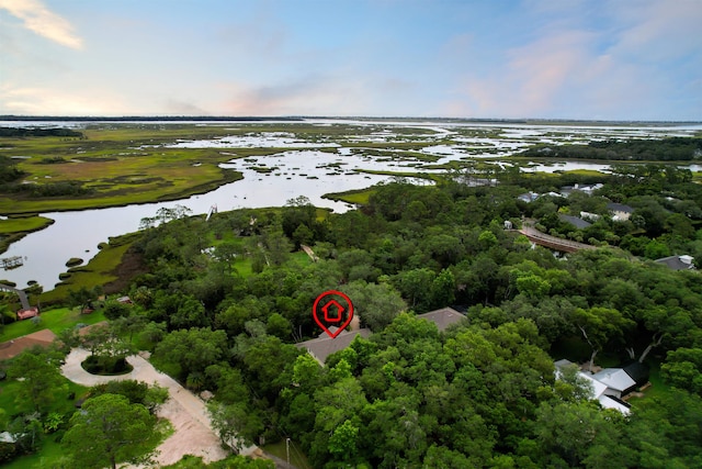 aerial view at dusk with a water view