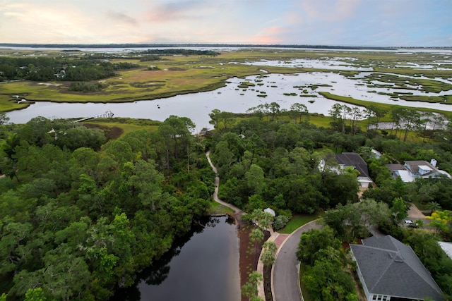 aerial view at dusk with a water view