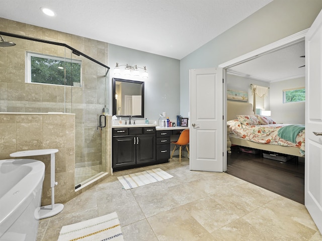 bathroom featuring vanity and an enclosed shower