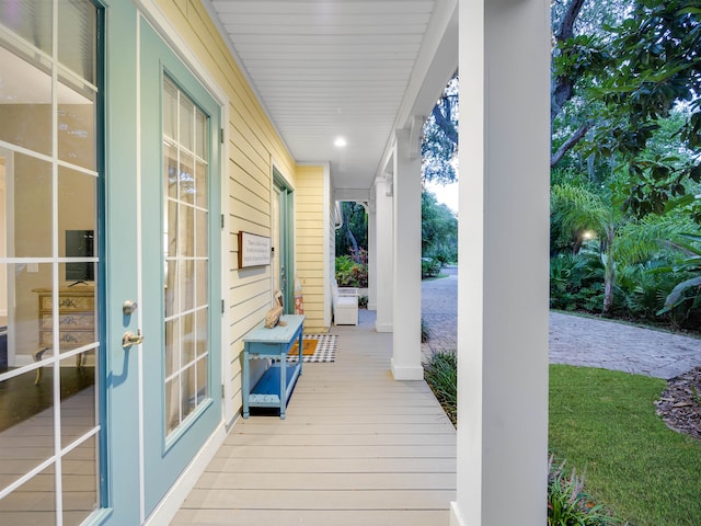 wooden terrace with a porch