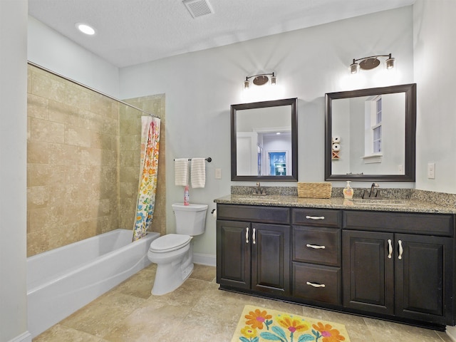 full bathroom with shower / bath combo, vanity, a textured ceiling, and toilet