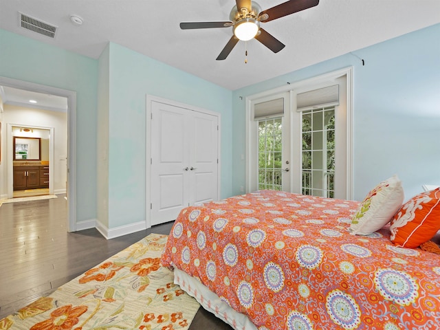 bedroom with ceiling fan, dark wood-type flooring, and access to outside