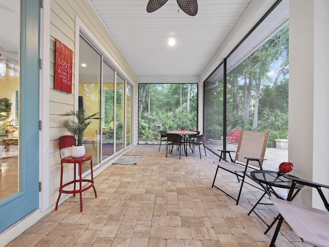 sunroom / solarium with ceiling fan