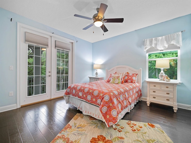 bedroom with ceiling fan, dark hardwood / wood-style flooring, access to exterior, and a textured ceiling