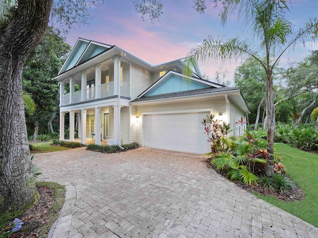 view of front of home featuring covered porch and a balcony