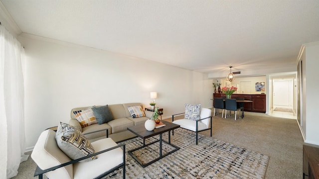 living room with light colored carpet and ornamental molding