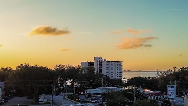 outdoor building at dusk featuring a water view