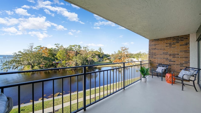 balcony featuring a water view