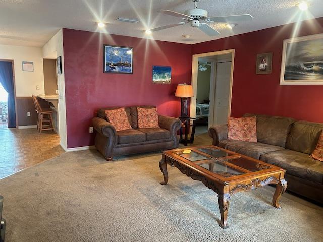 1417 Golf Ave, Ormond Beach, FL 32174 - living room featuring ceiling fan and carpet