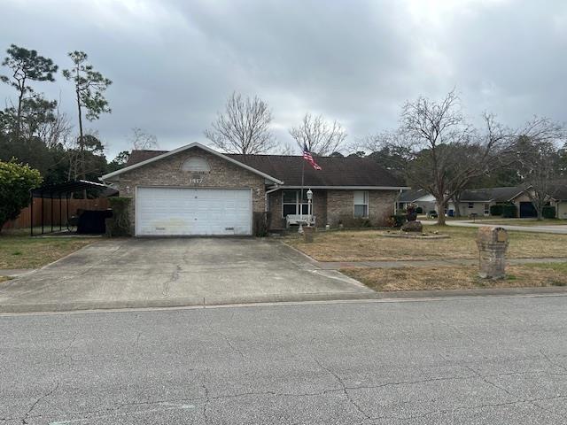 1417 Golf Ave, Ormond Beach, FL 32174 - ranch-style house with driveway and a garage