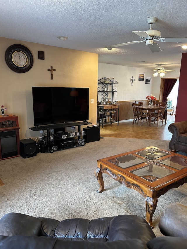1417 Golf Ave, Ormond Beach, FL 32174 - carpeted living room featuring a ceiling fan and a textured ceiling