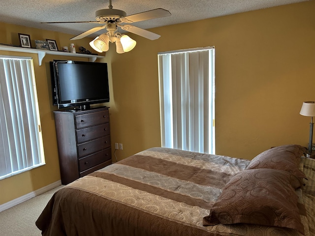 1417 Golf Ave, Ormond Beach, FL 32174 - bedroom with carpet, ceiling fan, and a textured ceiling