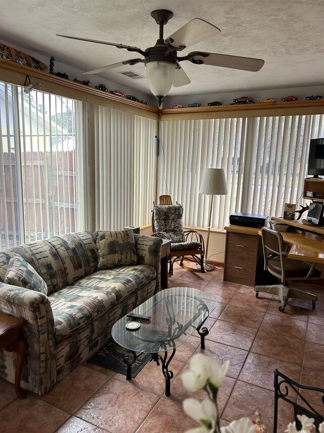 1417 Golf Ave, Ormond Beach, FL 32174 - living room with a ceiling fan, an office area, and stone finish floors
