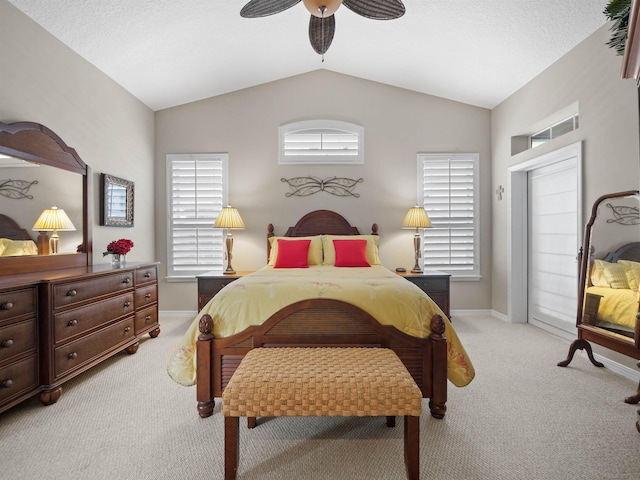 carpeted bedroom featuring ceiling fan and lofted ceiling