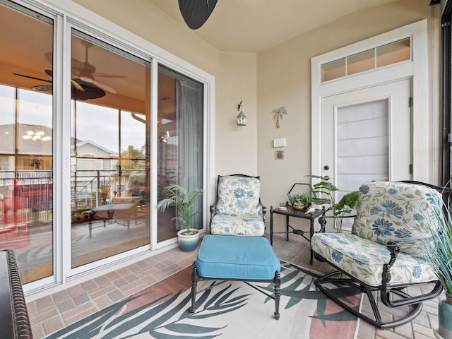 exterior space featuring ceiling fan