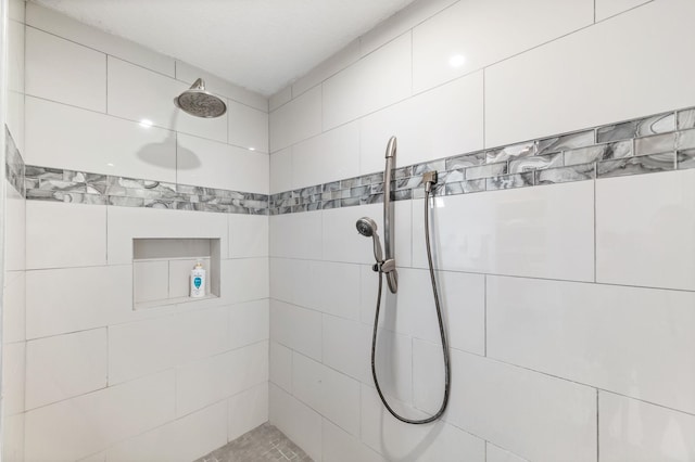 bathroom with tiled shower