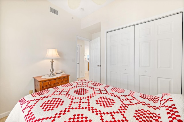 bedroom with ceiling fan and a closet