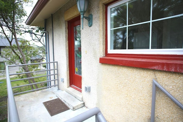 78 Riberia St, Saint Augustine, FL 32084 - property entrance featuring stucco siding