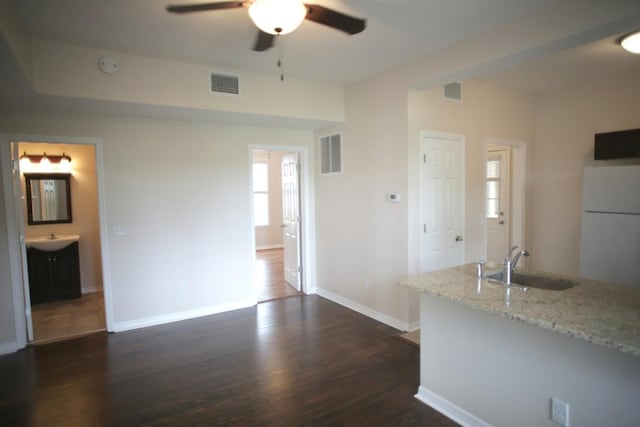 78 Riberia St, Saint Augustine, FL 32084 - unfurnished living room with a sink, ceiling fan, dark wood finished floors, baseboards, and plenty of natural light