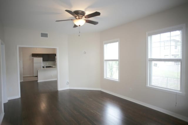 78 Riberia St, Saint Augustine, FL 32084 - spare room featuring a ceiling fan, dark wood-style floors, and baseboards