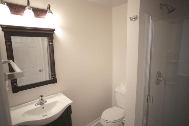 78 Riberia St, Saint Augustine, FL 32084 - bathroom featuring toilet, vanity, a shower, and baseboards