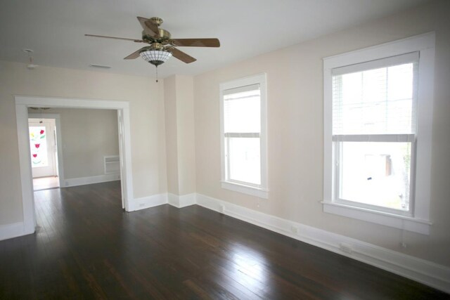 78 Riberia St, Saint Augustine, FL 32084 - spare room featuring dark wood-style floors, baseboards, and ceiling fan