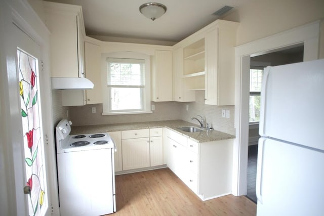 78 Riberia St, Saint Augustine, FL 32084 - kitchen with white appliances, a sink, under cabinet range hood, backsplash, and open shelves