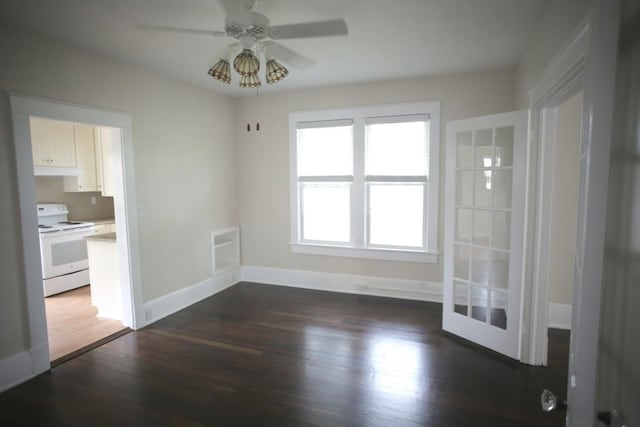 78 Riberia St, Saint Augustine, FL 32084 - unfurnished dining area featuring healthy amount of natural light, dark wood-style flooring, ceiling fan, and baseboards