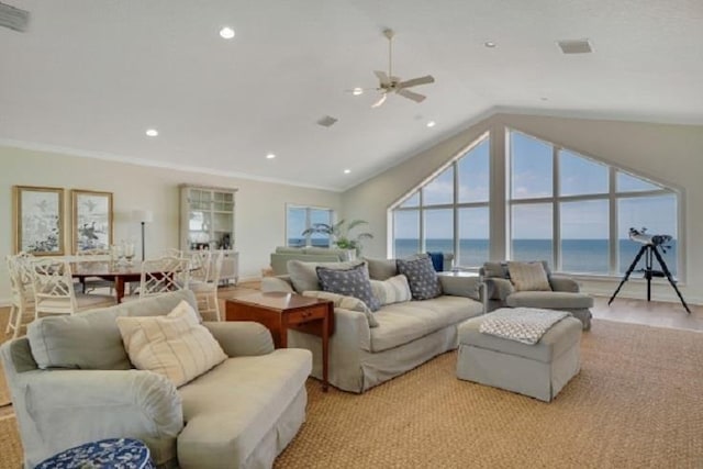 living room with ceiling fan, a water view, lofted ceiling, and ornamental molding