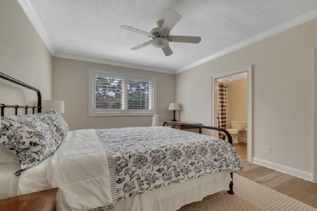 bedroom with ensuite bathroom, ornamental molding, a textured ceiling, ceiling fan, and light hardwood / wood-style flooring