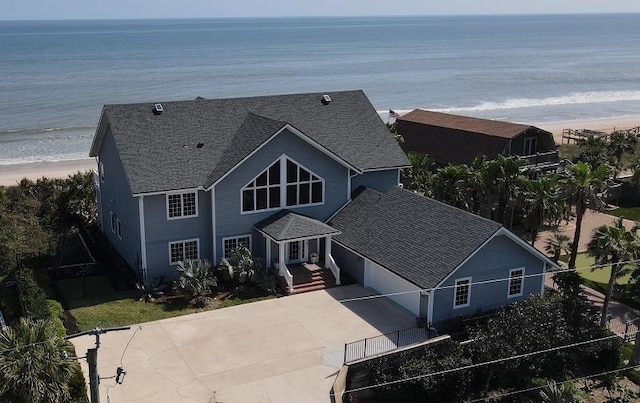 bird's eye view with a water view and a beach view