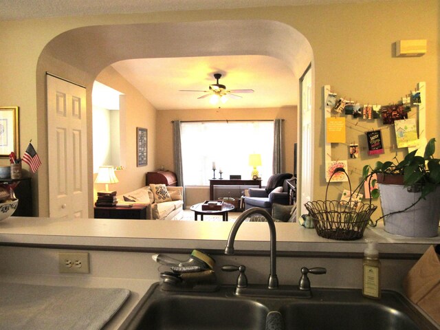 28212 Harbour Vista Cir, Saint Augustine, FL 32080 - kitchen featuring arched walkways, a sink, and ceiling fan