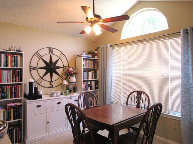 28212 Harbour Vista Cir, Saint Augustine, FL 32080 - dining space with lofted ceiling, a ceiling fan, and light colored carpet