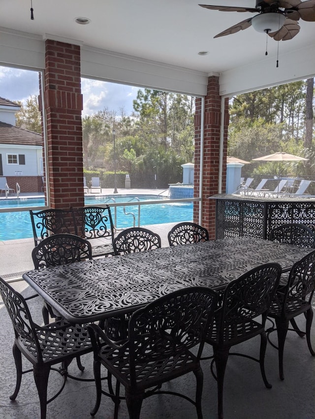 35103 Harbour Vista Cir, Saint Augustine, FL 32080 - view of patio featuring a community pool, a ceiling fan, and outdoor dining area