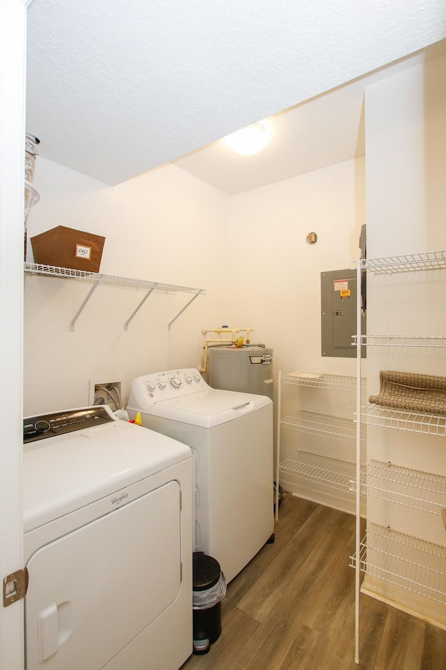 35103 Harbour Vista Cir, Saint Augustine, FL 32080 - laundry area featuring laundry area, wood finished floors, washer and dryer, gas water heater, and electric panel