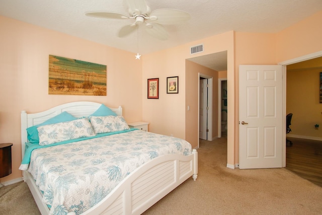 35103 Harbour Vista Cir, Saint Augustine, FL 32080 - bedroom featuring light colored carpet, baseboards, visible vents, and a ceiling fan