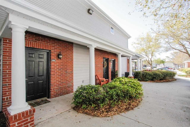 35103 Harbour Vista Cir, Saint Augustine, FL 32080 - view of exterior entry featuring covered porch and brick siding