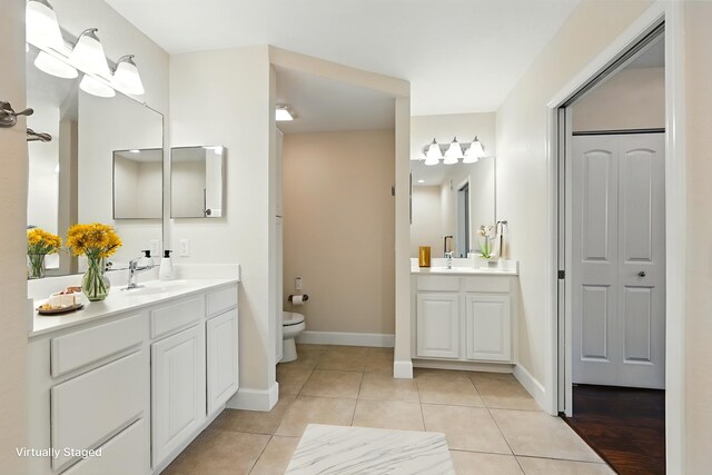 623 Shores Blvd, Saint Augustine Shores, FL 32086 - bathroom with a closet, vanity, tile patterned floors, toilet, and baseboards