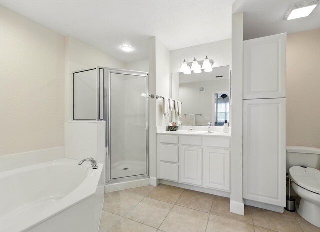 623 Shores Blvd, Saint Augustine Shores, FL 32086 - full bathroom featuring vanity, a stall shower, a garden tub, and toilet