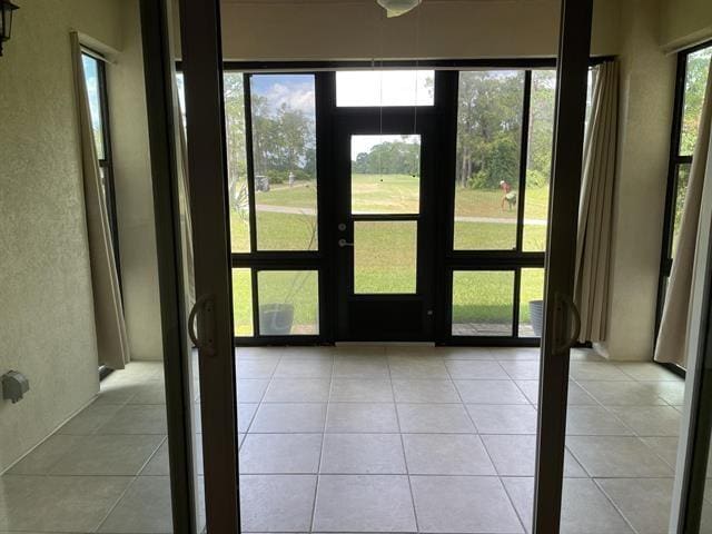 623 Shores Blvd, Saint Augustine Shores, FL 32086 - doorway to outside featuring light tile patterned floors and a wealth of natural light