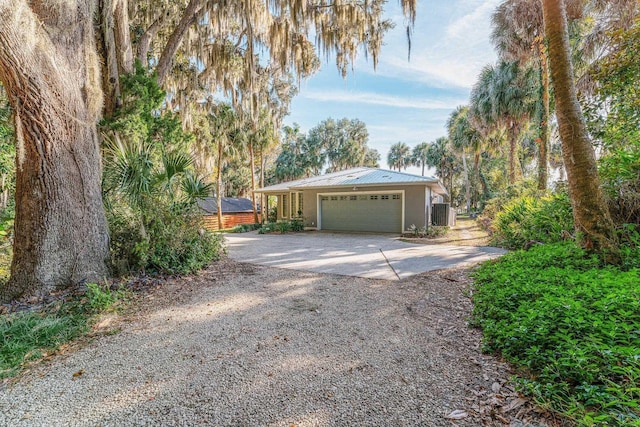 garage with concrete driveway