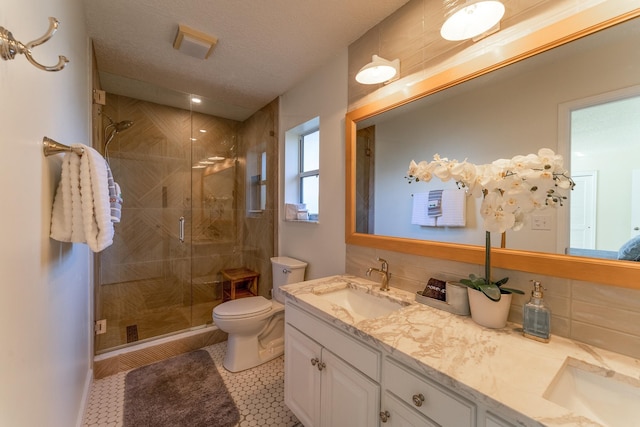 277 W River Rd, Palatka, FL 32177 - full bath featuring double vanity, a sink, a shower stall, a textured ceiling, and toilet