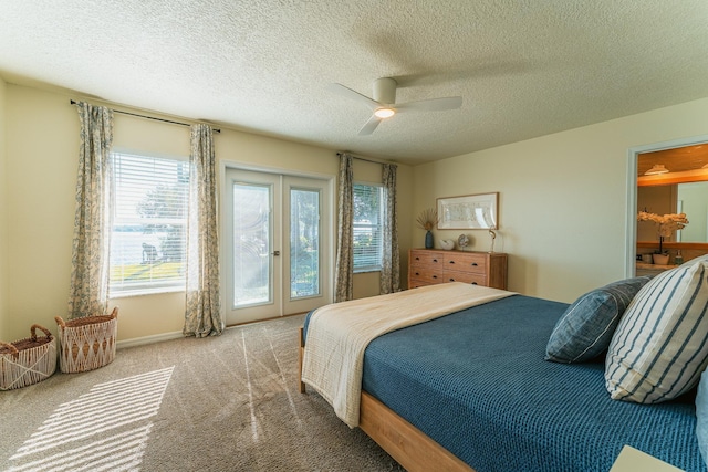 bedroom with ceiling fan, carpet floors, french doors, a textured ceiling, and access to outside