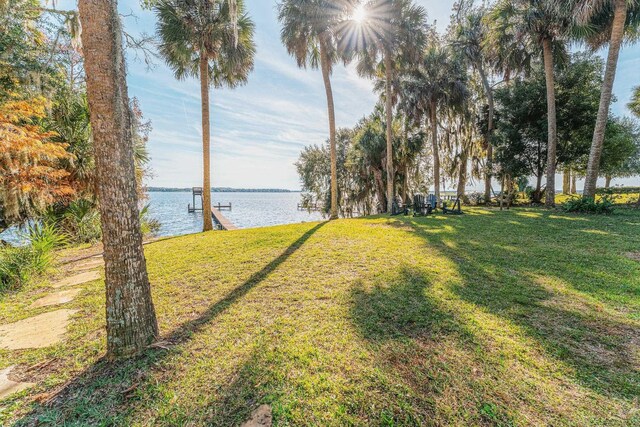 277 W River Rd, Palatka, FL 32177 - view of yard featuring a boat dock and a water view