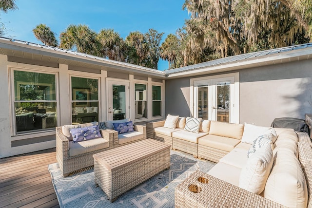 wooden deck featuring french doors and an outdoor hangout area