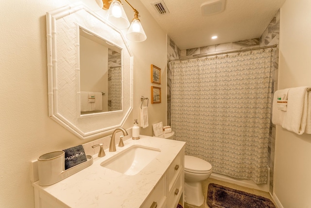 full bath featuring visible vents, toilet, a textured ceiling, and vanity